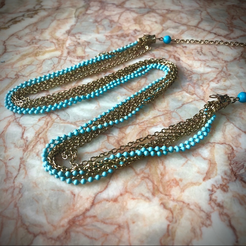 Multi layer turquoise long gold tone necklace